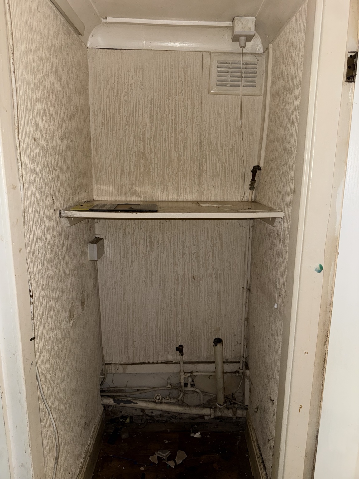 Edge Street, St Helens — service cupboard before refurbishment